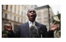 Herman Cain claims he's no motivational speaker but does motivate his audience.